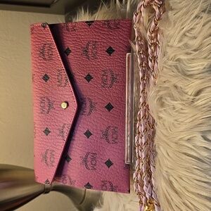 MCM Visetos envelope clutch in pinkwith a gold chain strap. New Without The Tag